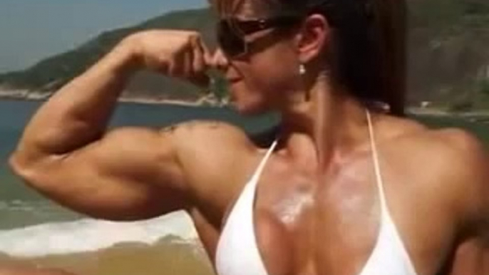 Women Stunning Brazilian female Bodybuilding posing on the beach