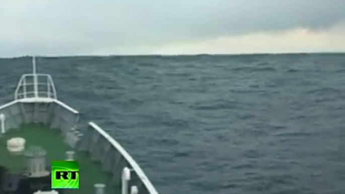 Tsunami Climbing Incredible video of ship heading into wave in Japan