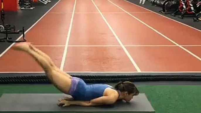 Girl Stretches Legs over Head