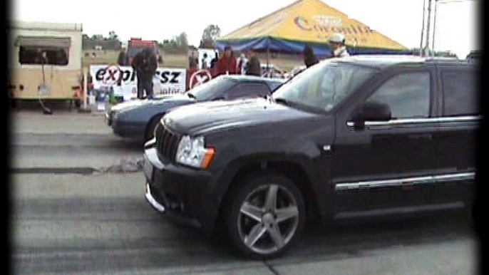 Jeep Grand Cherokee Vs. Mazda RX 7 Turbo Drag Race