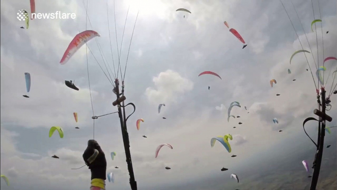 Paragliding in the middle of dozens of other pilots