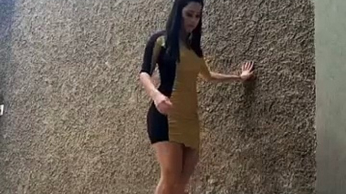 High Heeled Girl Juggles Soccer Ball