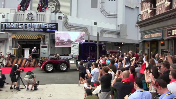 Optimus Prime, Bumblebee, Megatron transform & talk at Transformers grand opening in Orlando