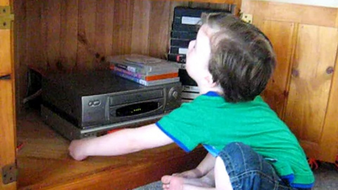 Jake as a toddler watching Peppa Pig and giggling, very cute