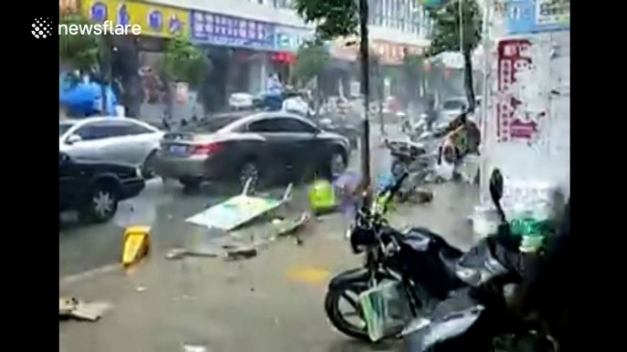 Strong wind in China blows roofs of buildings and people off their feet