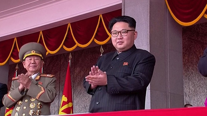 Kim Jong-un makes rare extended TV appearance at vast parade in Pyongyang