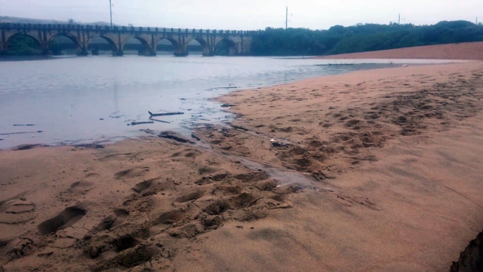 Black Rock River ( mahlongwa) river breaching into the Indian ocean