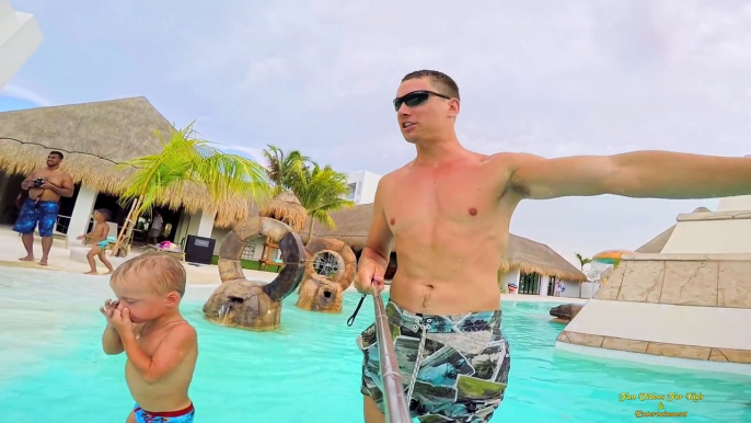 Maxim playing at kids waterpark in Cancun Mexico & having lots of fun on waterslides plays with toys