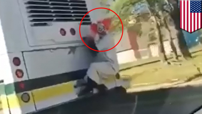 Clown craze: Creepy clown caught on tape hitching ride on the back of Detroit bus