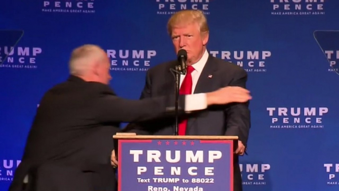 Man led away by officers after Trump rushed offstage at Reno rally