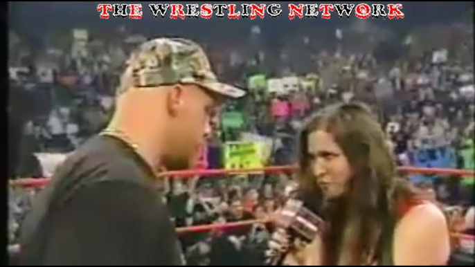 Stone Cold gives Stephanie Mcmahon a hand