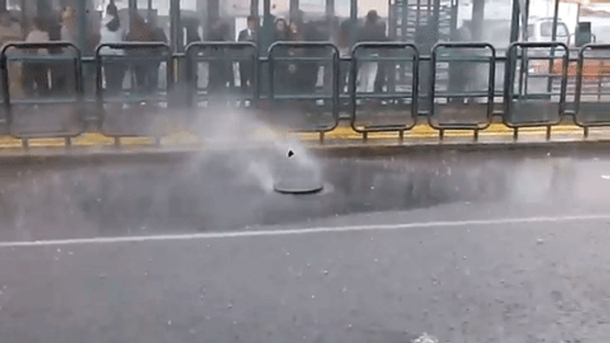 Water Sprays From Manhole During Torrential Rain in Quito