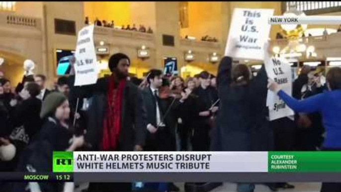 'USA Out Of Everywhere' Anti-Syrian-war protest disrupts White Helmets pop-up music tribute