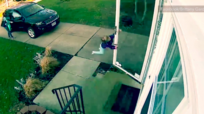 Surveillance captures little girl blown away by strong winds