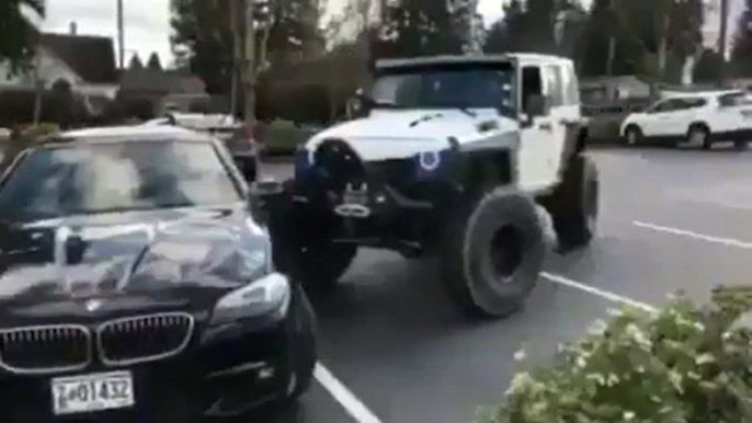 dude move park bmw with his jeep in parking lot