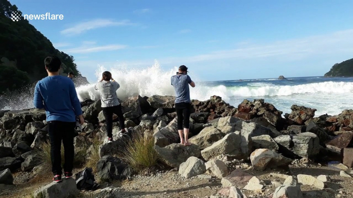 Beach goers get soaked by large wave