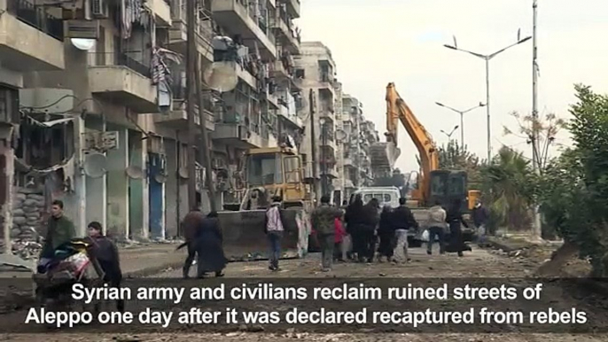 Syria army, civilians reclaim ruined 23423w