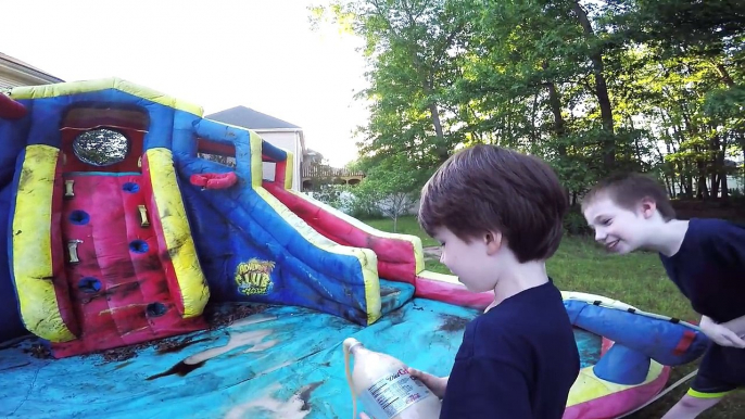 SCARY KILLER CLOWN ATTACKS Through Inflatable Water Slide while doing a Mentos Coke Experi