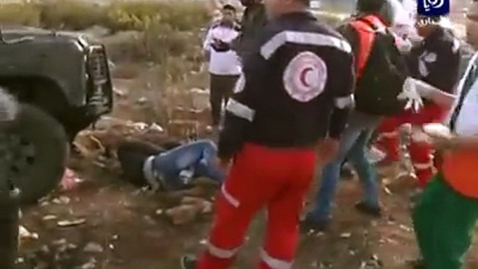 Israeli Forces run over a Palestinian youth and when medics approach to help the injured youth, the border police officer pepper sprays them..