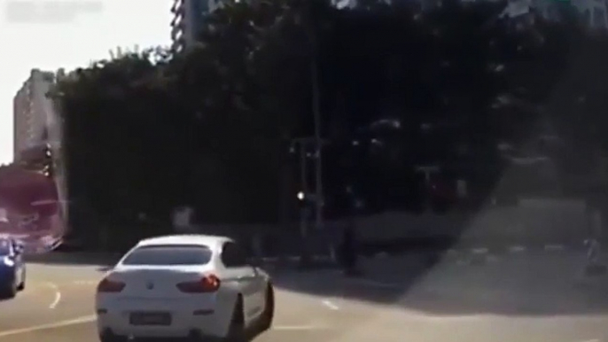 Bizarre moment 'ghost car' appears out of nowhere to cause crash in Singapore