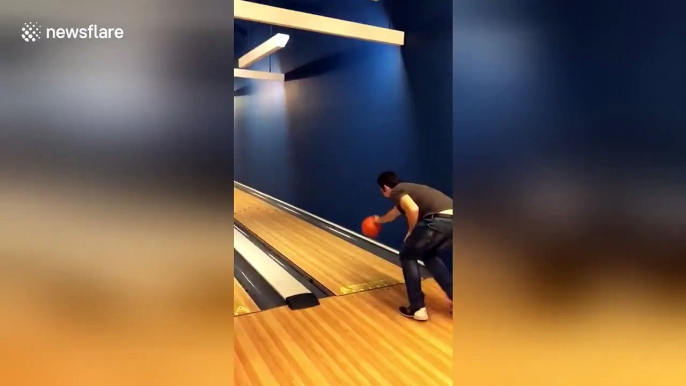 Man's fingers get stuck in bowling ball as he goes bowling for the first time