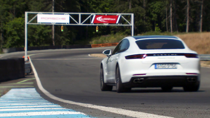 Porsche Panamera Turbo S E-Hybrid in White Metallic Driving on the track