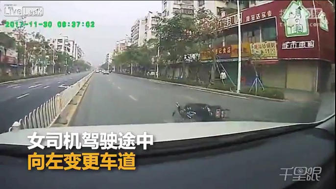 Motorcyclist cuts a car off a car and gets run over, saved by his helmet