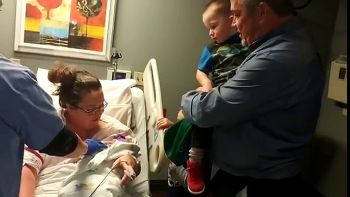 Mom Cradles Tiny Newborn, Then Removes Blanket To Reveal A Message For Grandpa On Her Ones