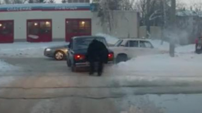 Russian Bystander Casually Lifts A Stuck Car Out Of A Snow Rut