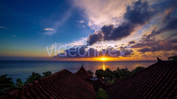 Sunrise Overlooking The Roofs Of The Bungalows And The Ocean in Bali by Timelapse4K