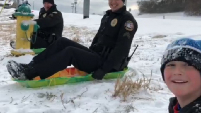 Tennessee Police Officers Challenge Local Kids to Sled Race