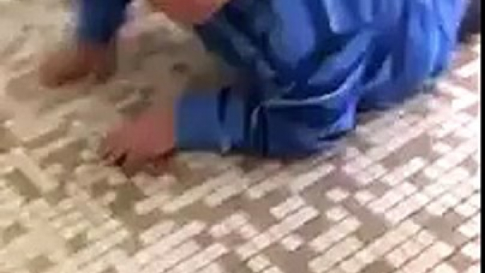 Mexican Kid Crawls under guy's stall in a public restroom