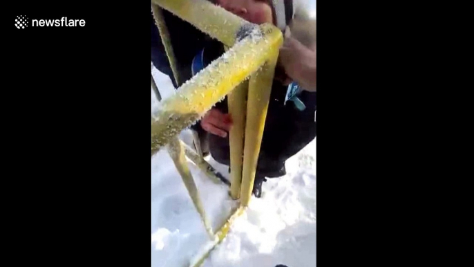 Boy gets his tongue stuck to icy metal fence