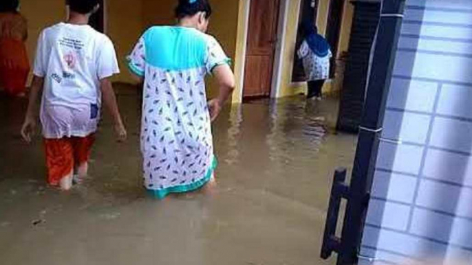 Locals Wade Through Flooded Streets in Cirebon, Indonesia