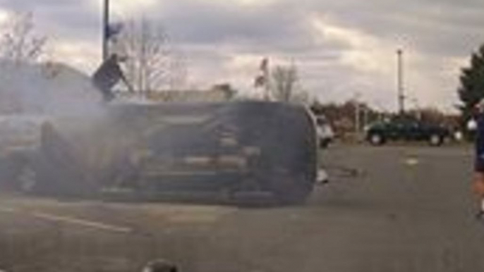 Passers-By Flip Over Burning Car to Rescue Driver Trapped After Crash