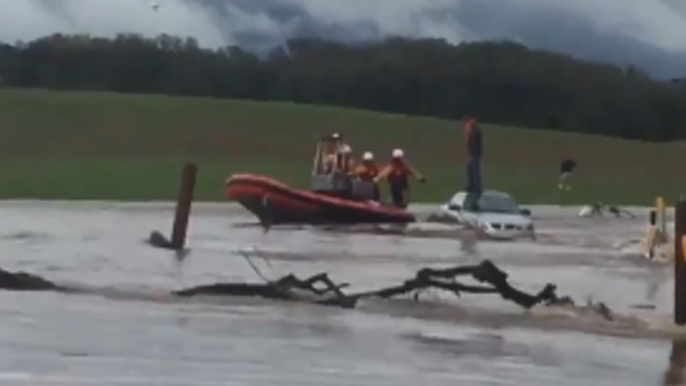 California Firefighters Rescue Person Stranded on Car in Flash Flood