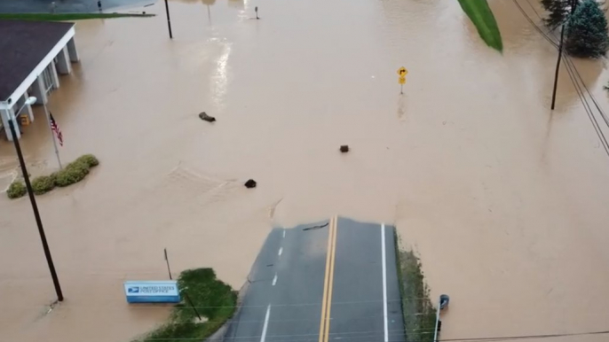 Roads and Buildings Submerged as Flash Flooding Hits West Virginia