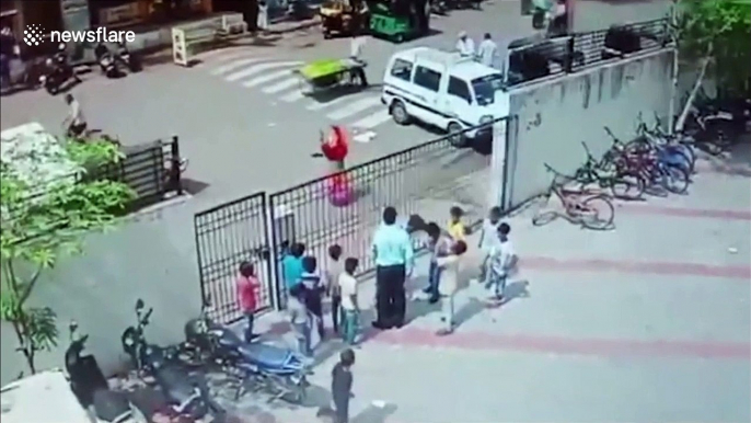 Terrifying moment heavy school gate collapses on children