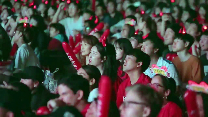 Korean fans cheering after their team scores a goal against Germany