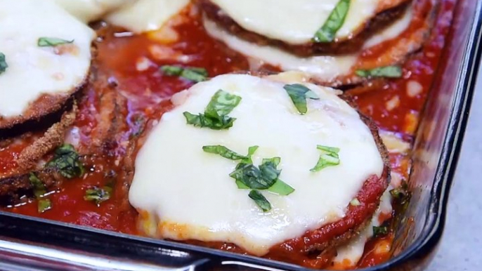 An oven-fry method creates this crispy BAKED EGGPLANT PARMESAN that rivals any fried version. An easy, updated take on the classic Italian dish![Click the phot