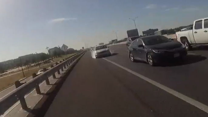 Police Officer Jumps From Path of Moving Car on Texas Highway