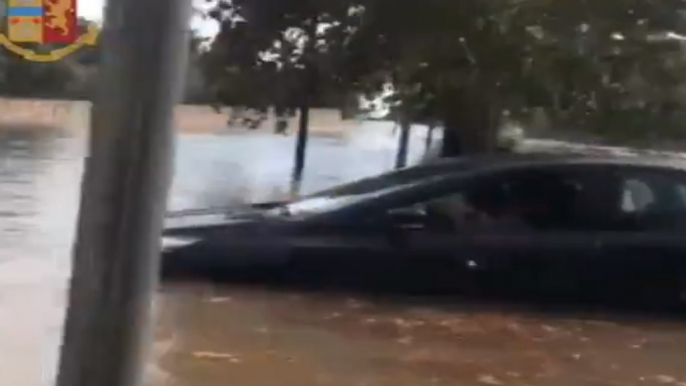 Italian Police Rescue Family From Car Trapped in Floodwater in Taranto