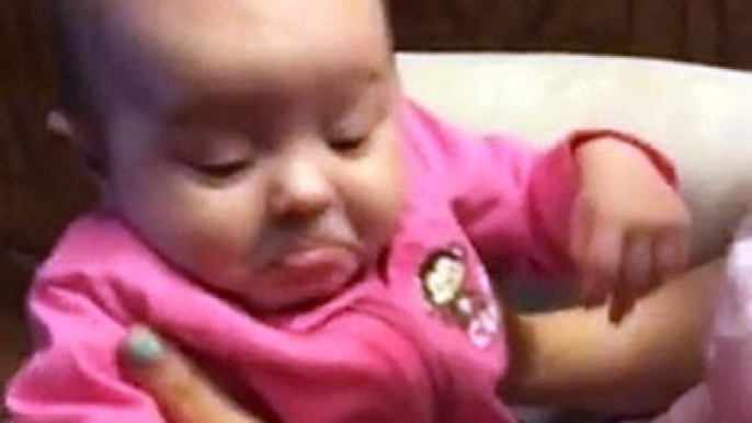 Baby girl not a fan of her mom's singing
