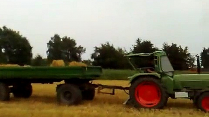 Farmers Working And Playing At The Same Time