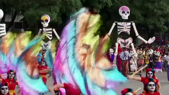 Giant skeletons dance in Mexico for Day of the Dead parade