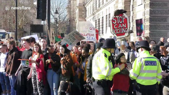 Schoolchildren stage sit-down protest outside UK Houses of Parliament