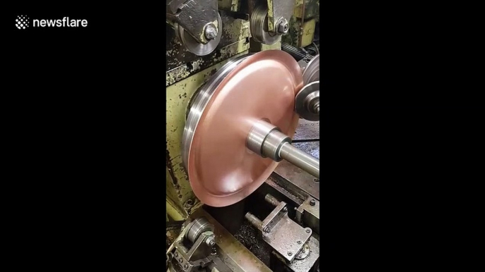 Hypnotic 'metal spinning' machine perfectly shapes copper disc into dome