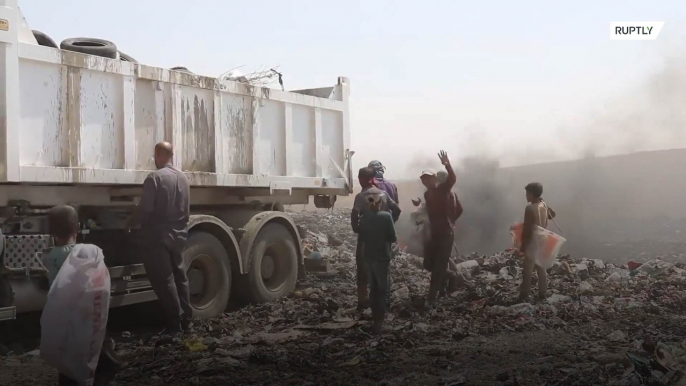 Mosul's children scavenge through rubbish to survive