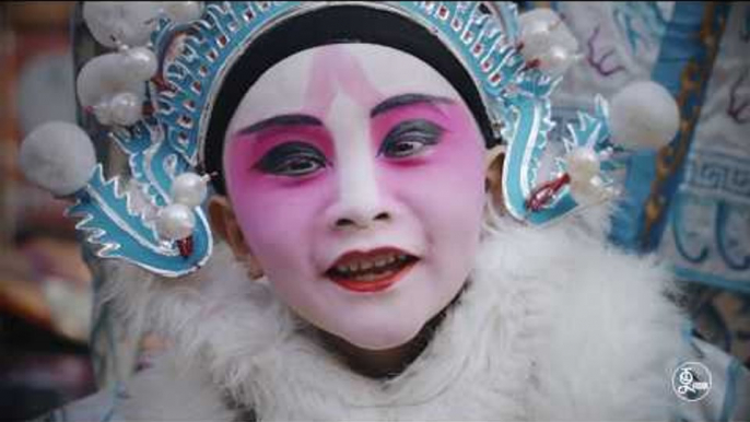 The kid actor in Chinese opera-performing on the adult's shoulder | More China