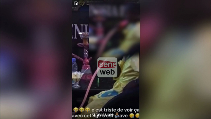 une petite fille qui fume du chicha